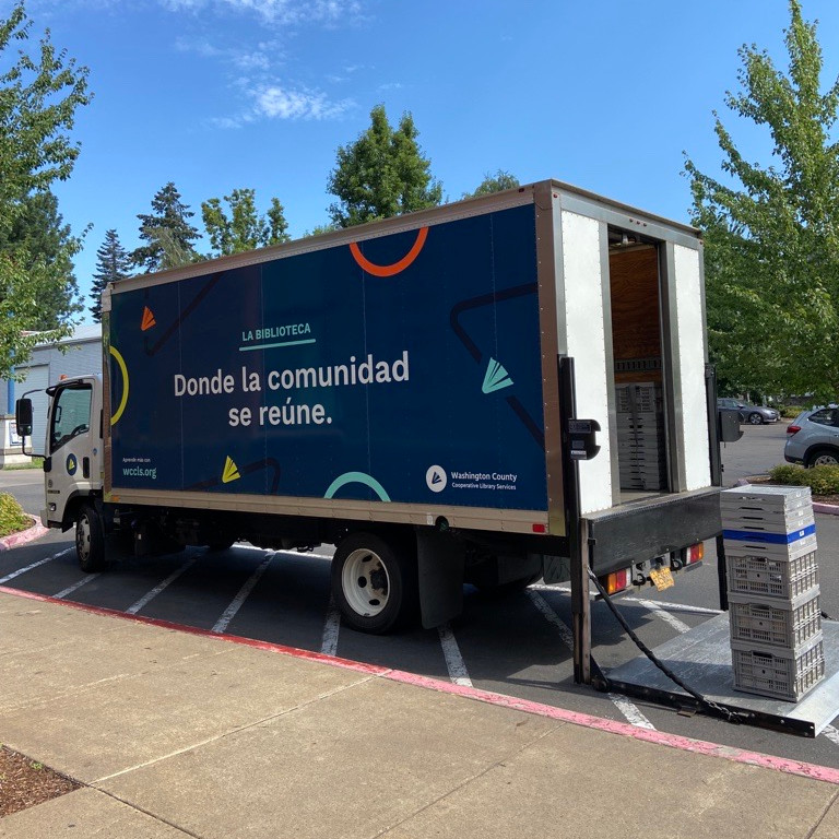 Courier truck outside a library