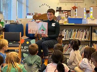 A West Slope librarian reading to children.