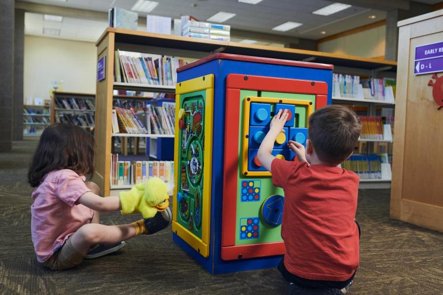 Two children play at the Beaverton City Library